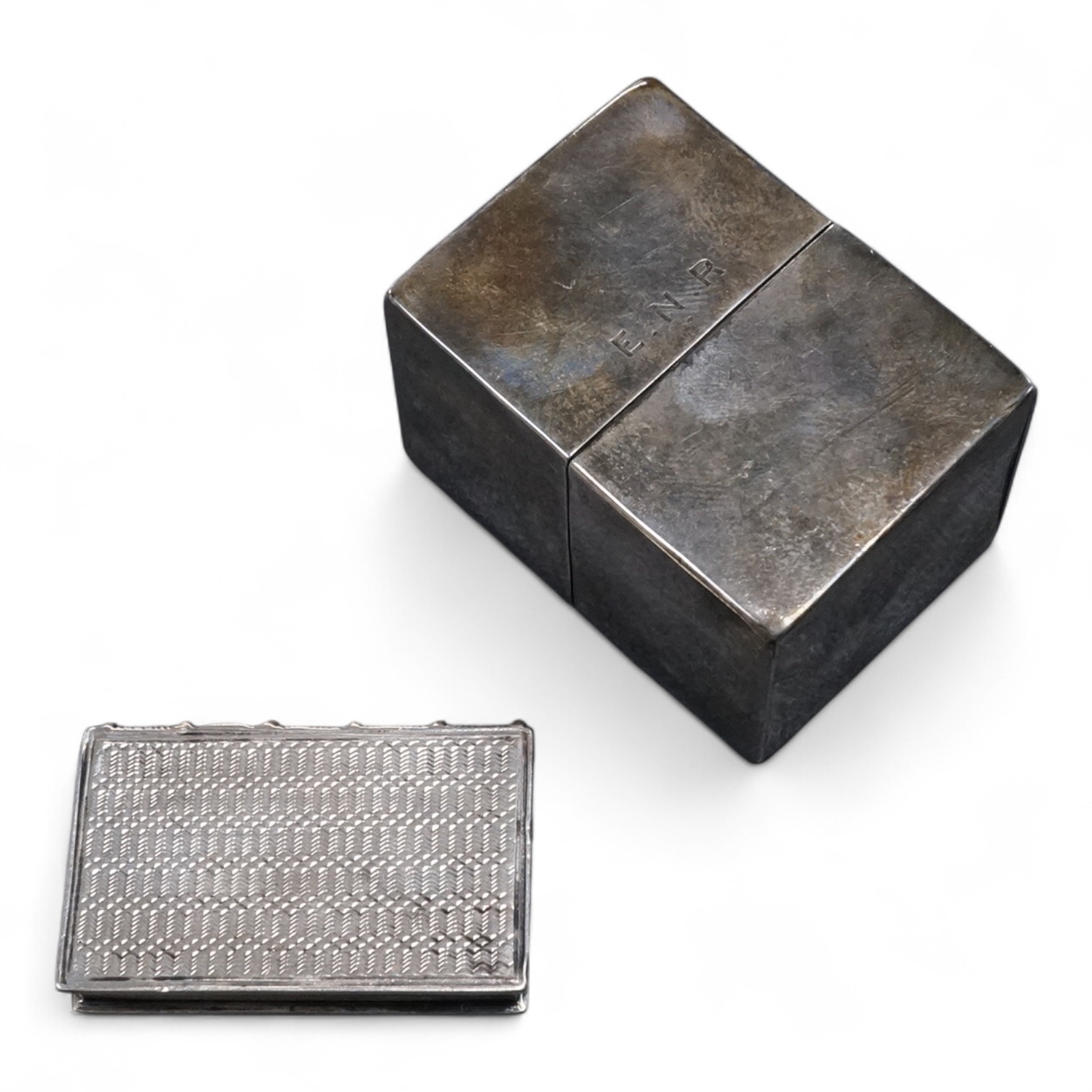 A William IV silver 'book' vinaigrette by Taylor & Perry, Birmingham, 1835, 40mm, together with a white metal box and cover.